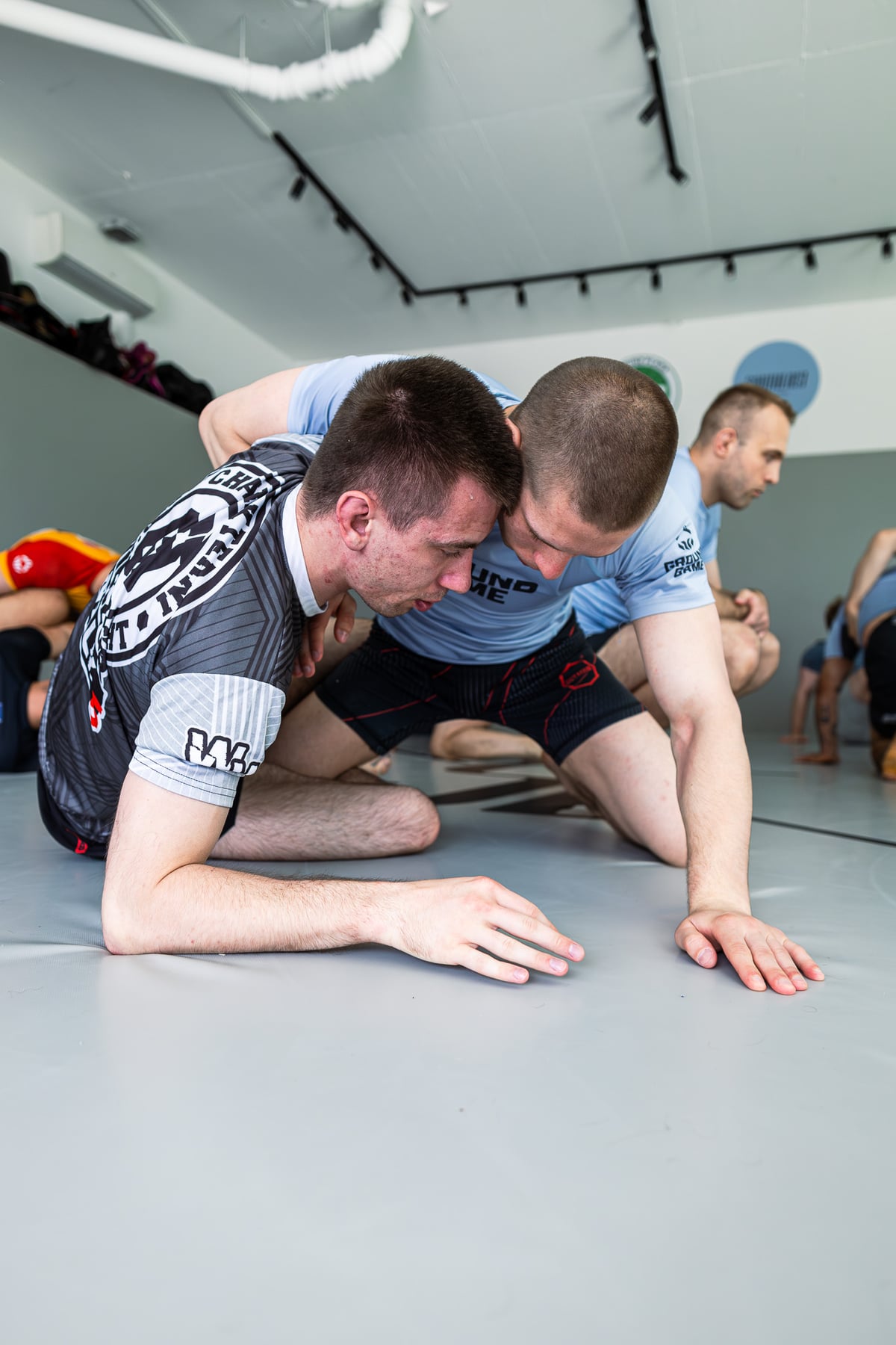 Two club members practising a Jiu-Jitsu technique on the mat at Southeast